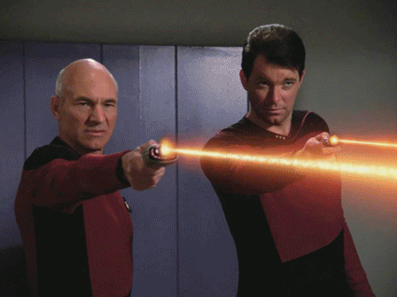 Picard and Riker use phasers to explode whatshisface's head.