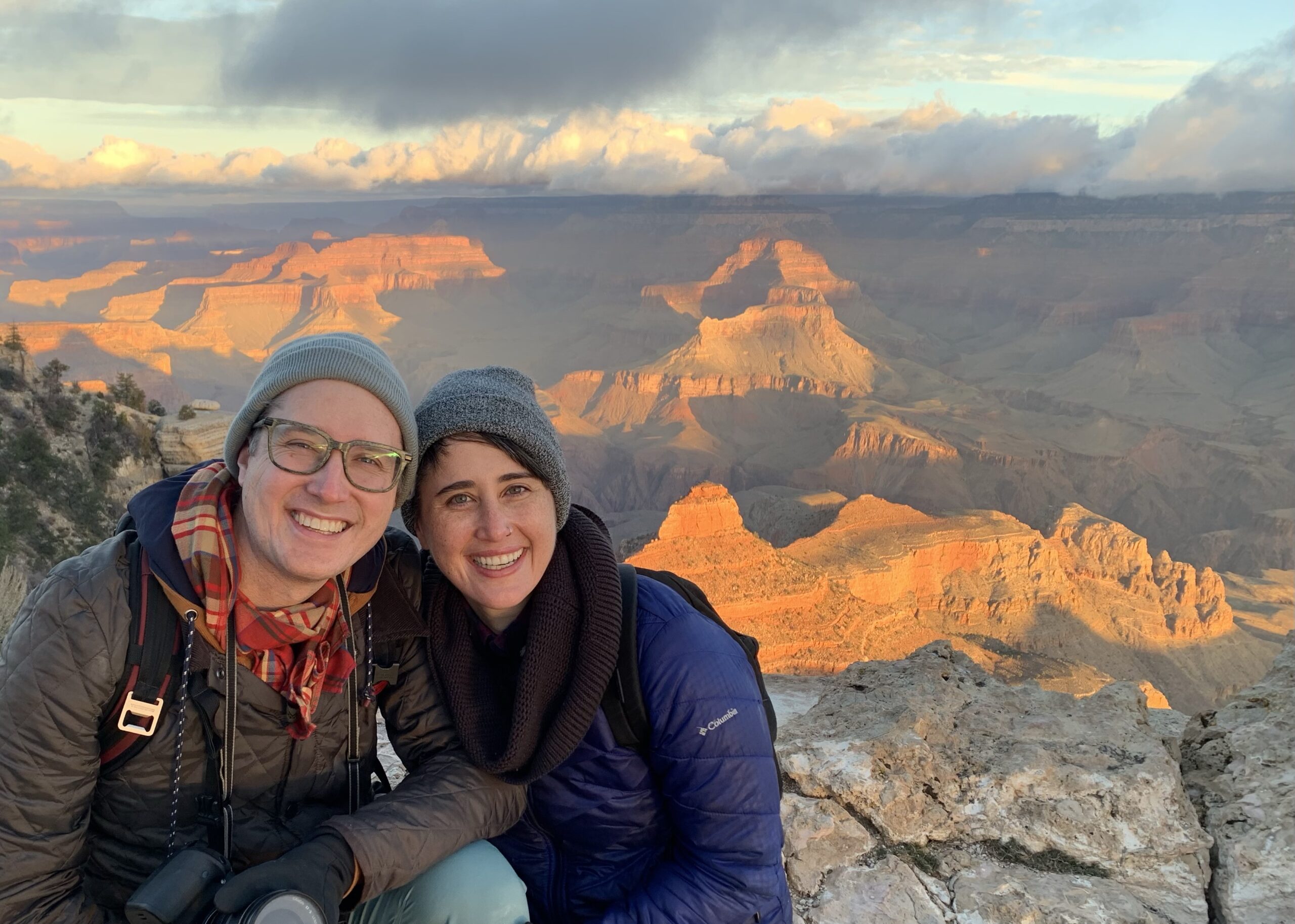 Brendan on the left, Kat in the middle, Grand Canyon sunrise on the right.