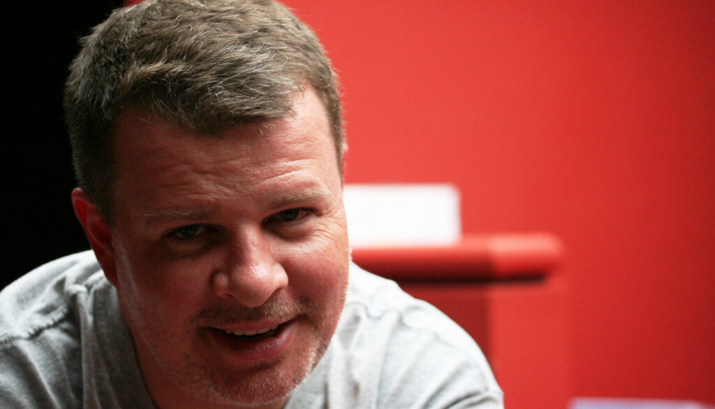 Chris, in a red room, weary in 2008.