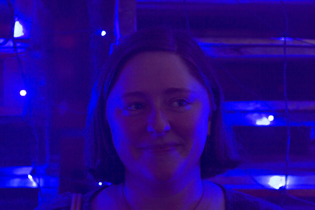 Erin at Bit Bash in 2015, lit entirely in blue.